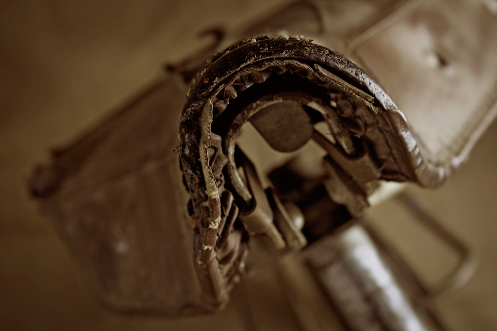 The seat of an old bicycle as seen from the front. The image is part of a series of photos of this bike, with each image concentrating on a different component.